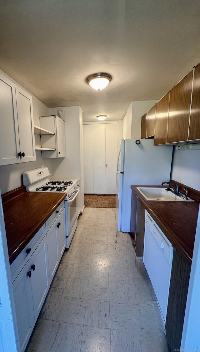 31 Woodland St Unit 7F, Hartford, CT 06103 - kitchen with white appliances, butcher block counters, light flooring, open shelves, and white cabinetry