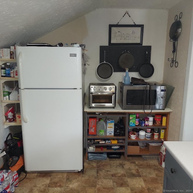 3 Prospect Pl, Middletown, CT 06457 - kitchen with freestanding refrigerator, stainless steel microwave, and vaulted ceiling