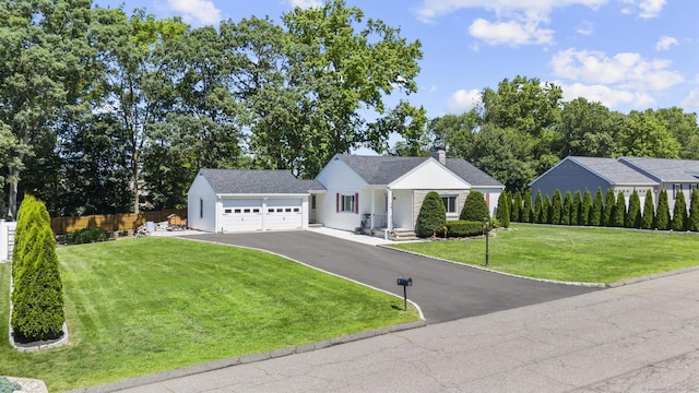 5 Greenfield Dr, Ansonia, CT 06401 - view of front of property featuring an attached garage, driveway, and a chimney