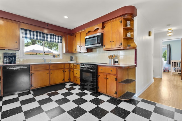 5 Greenfield Dr, Ansonia, CT 06401 - kitchen featuring black appliances, dark floors, light countertops, open shelves, and tasteful backsplash