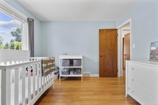 5 Greenfield Dr, Ansonia, CT 06401 - bedroom with light wood-type flooring and a nursery area