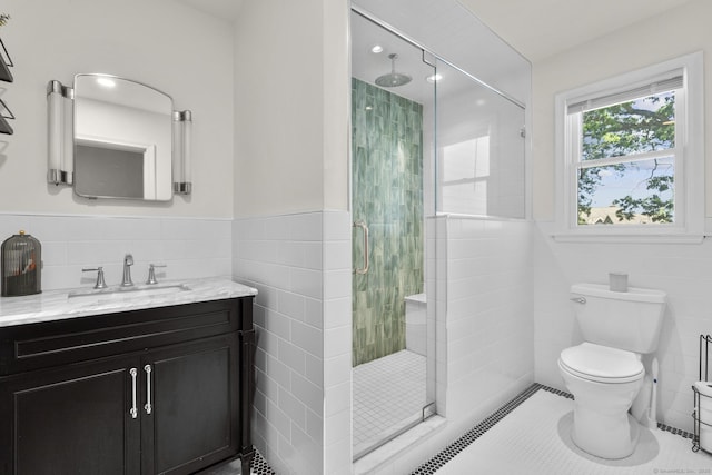 5 Greenfield Dr, Ansonia, CT 06401 - bathroom with tile walls, a stall shower, vanity, a wainscoted wall, and tile patterned flooring