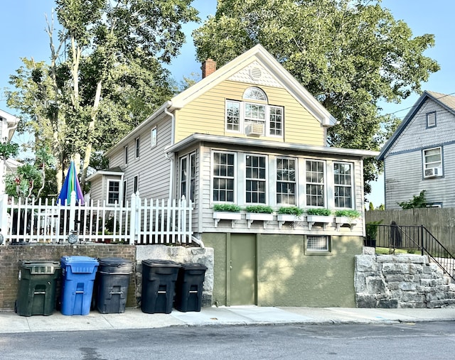 28 Grand St, New London, CT 06320 - view of front facade with a chimney and cooling unit