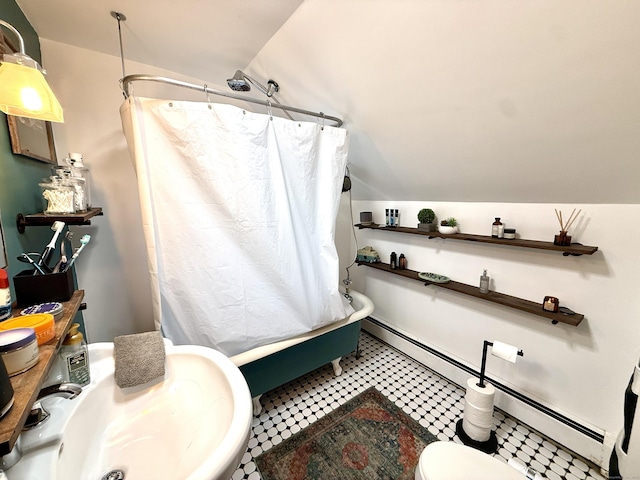 28 Grand St, New London, CT 06320 - bathroom featuring vaulted ceiling, a baseboard heating unit, and shower / bath combo with shower curtain