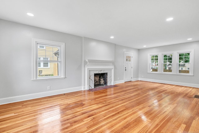 108 Adams St, New Britain, CT 06052 - unfurnished living room featuring a fireplace, wood finished floors, and recessed lighting