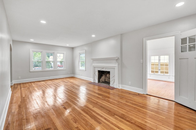 108 Adams St, New Britain, CT 06052 - unfurnished living room with light wood finished floors, a fireplace, and recessed lighting