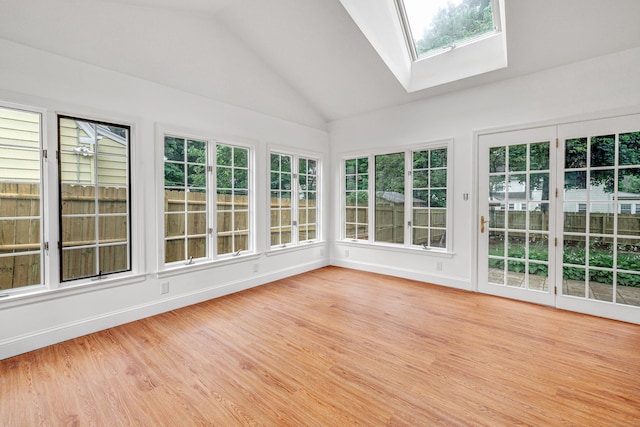 108 Adams St, New Britain, CT 06052 - unfurnished sunroom featuring a skylight, a wooden deck, vaulted ceiling, wood finished floors, and healthy amount of natural light