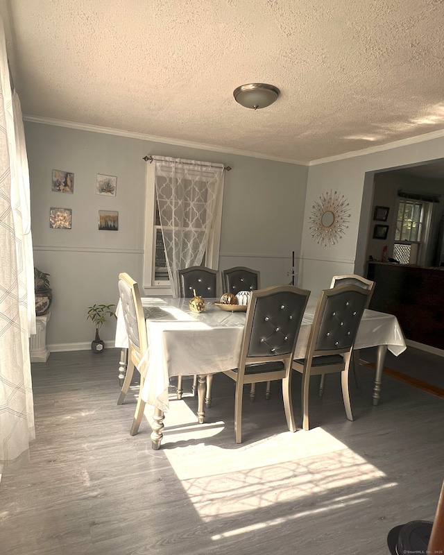 30 Roulin St, Torrington, CT 06790 - dining space featuring crown molding, a textured ceiling, and wood finished floors