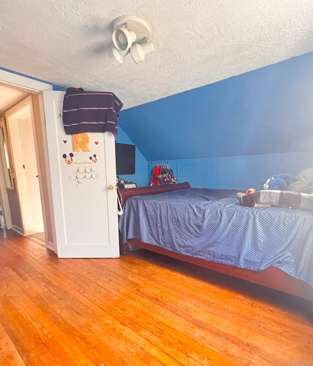 30 Roulin St, Torrington, CT 06790 - bedroom featuring a textured ceiling, light wood-type flooring, and lofted ceiling