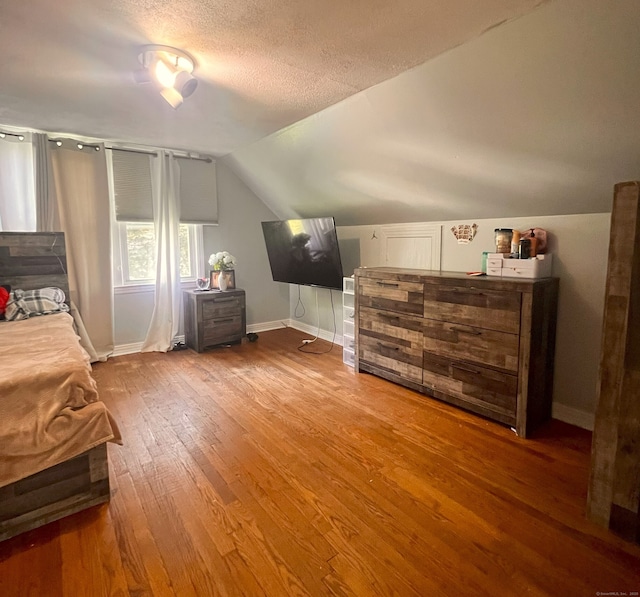 30 Roulin St, Torrington, CT 06790 - bedroom featuring wood finished floors, lofted ceiling, and a textured ceiling