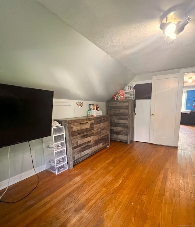 30 Roulin St, Torrington, CT 06790 - bonus room with wood finished floors, vaulted ceiling, and a textured ceiling