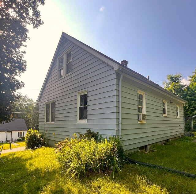 30 Roulin St, Torrington, CT 06790 - view of side of property with a chimney