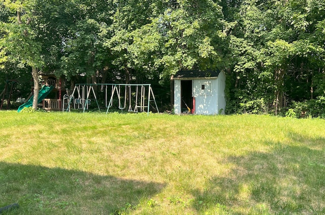 30 Roulin St, Torrington, CT 06790 - view of grassy yard with a playground and a storage unit