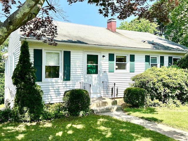 191 Prospect Hill Rd, Groton, CT 06340 - view of front of home with a front lawn and a chimney