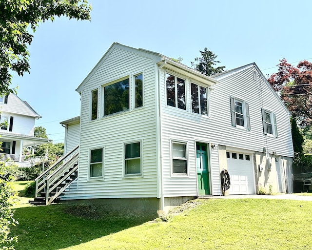 191 Prospect Hill Rd, Groton, CT 06340 - view of front facade featuring an attached garage, a front lawn, and stairway