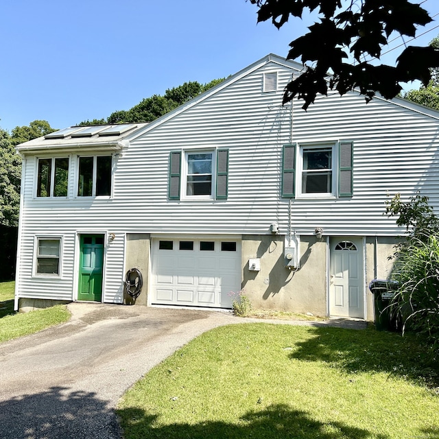 191 Prospect Hill Rd, Groton, CT 06340 - view of front facade with asphalt driveway, a front lawn, and a garage