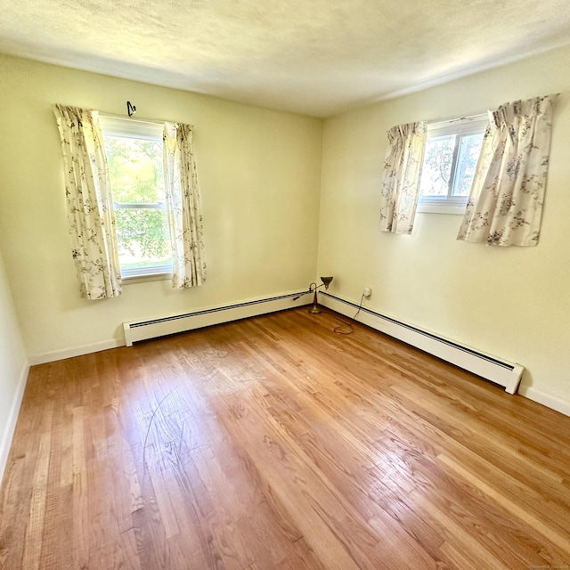 191 Prospect Hill Rd, Groton, CT 06340 - unfurnished room featuring a baseboard radiator and wood finished floors