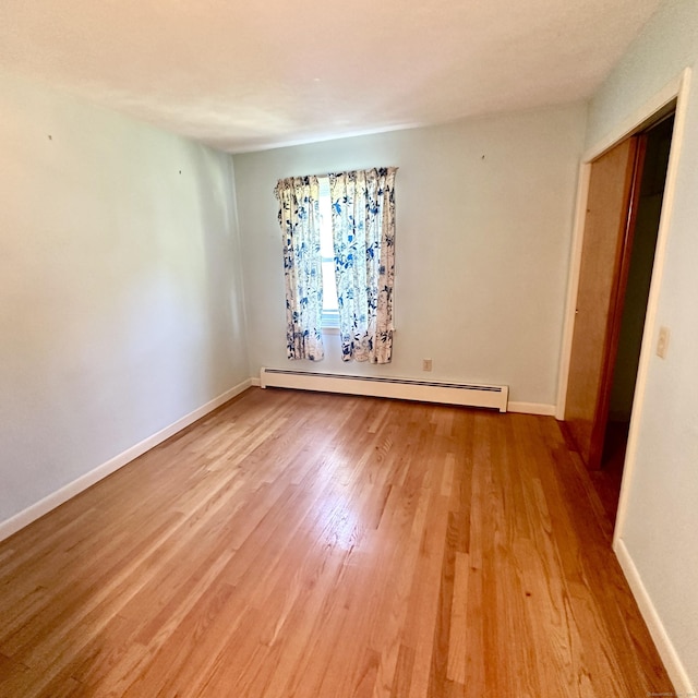 191 Prospect Hill Rd, Groton, CT 06340 - unfurnished room with a baseboard heating unit and wood finished floors
