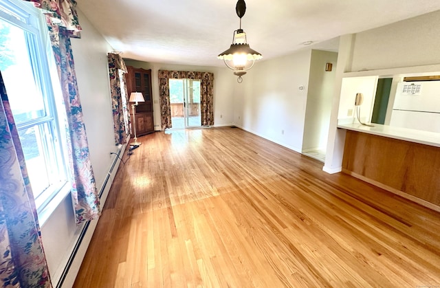 191 Prospect Hill Rd, Groton, CT 06340 - unfurnished living room with light wood-style floors and a baseboard radiator