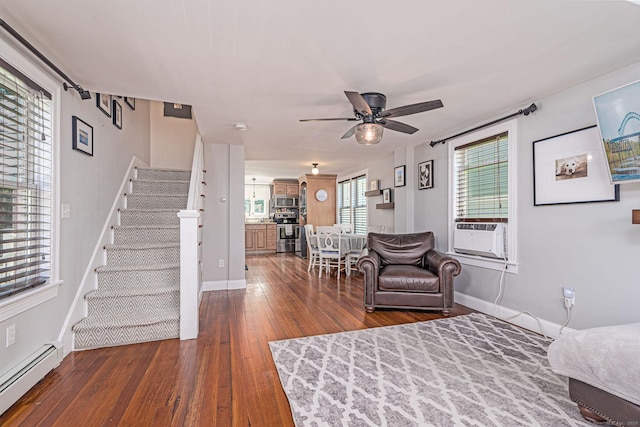 8 Johnson St, Stonington, CT 06379 - living room with cooling unit, a baseboard radiator, stairs, dark wood finished floors, and a ceiling fan