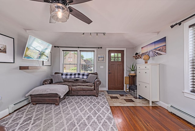 8 Johnson St, Stonington, CT 06379 - living area featuring a baseboard heating unit, track lighting, wood finished floors, and ceiling fan