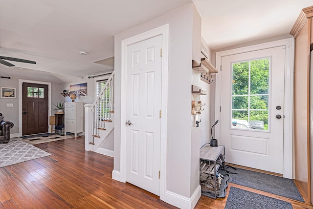 8 Johnson St, Stonington, CT 06379 - foyer with dark wood-type flooring, healthy amount of natural light, and stairway