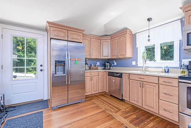 8 Johnson St, Stonington, CT 06379 - kitchen with stainless steel appliances, light wood-style flooring, light countertops, light brown cabinets, and healthy amount of natural light