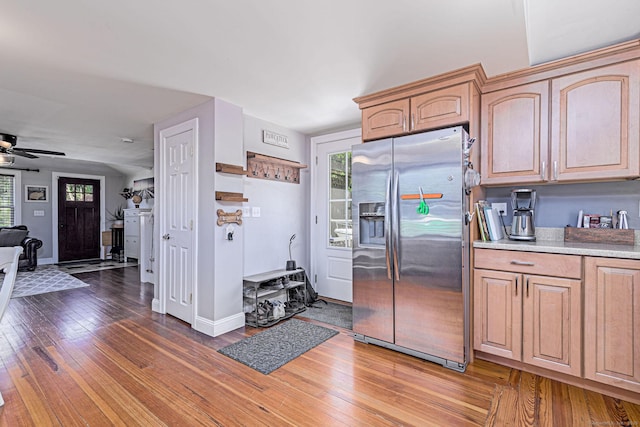 8 Johnson St, Stonington, CT 06379 - kitchen with stainless steel fridge, ceiling fan, light countertops, wood finished floors, and light brown cabinetry