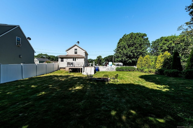 8 Johnson St, Stonington, CT 06379 - fenced backyard with a fire pit and a deck