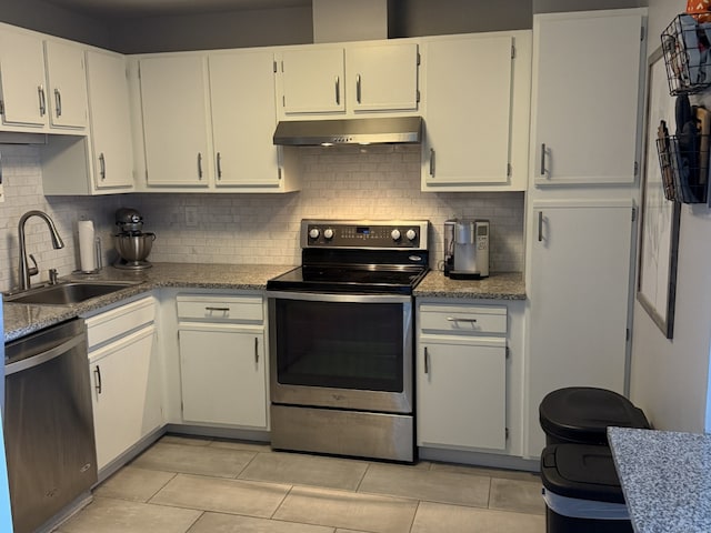 111 Dekoven Dr Apt 1008, Middletown, CT 06457 - kitchen with stainless steel appliances, under cabinet range hood, tasteful backsplash, and white cabinetry