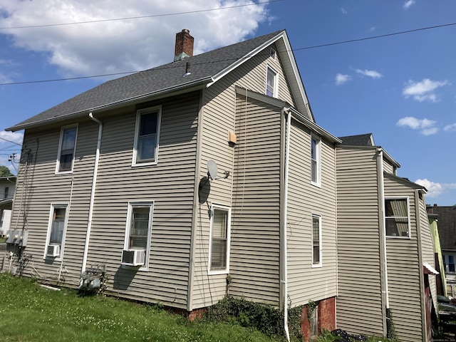 203 E Main St, Middletown, CT 06457 - view of side of property featuring a chimney and cooling unit