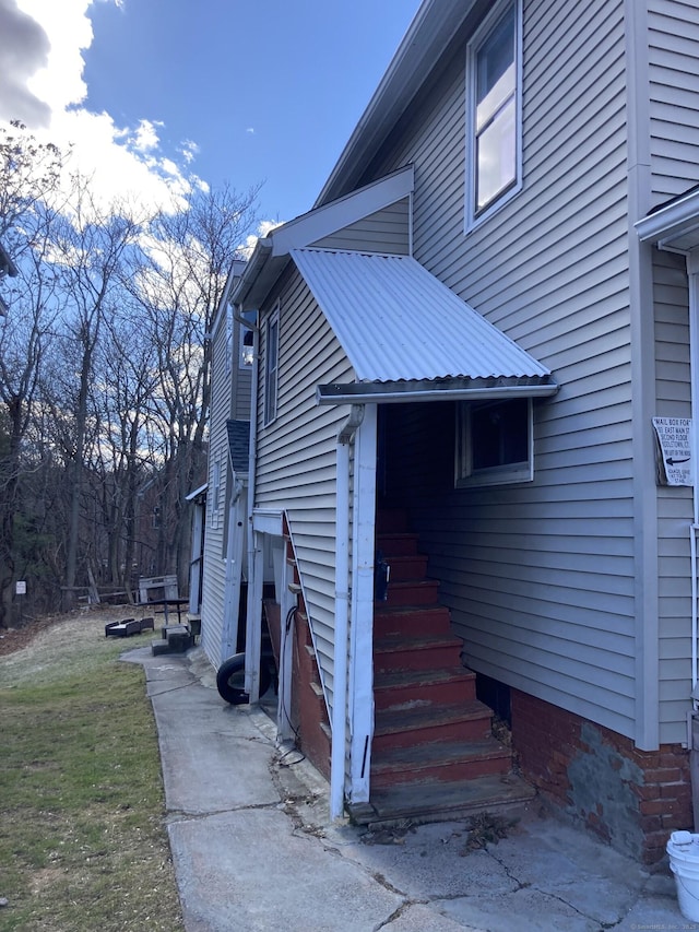 203 E Main St, Middletown, CT 06457 - view of home's exterior with a metal roof and a yard