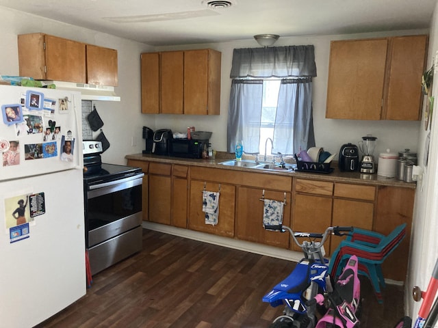 203 E Main St, Middletown, CT 06457 - kitchen with freestanding refrigerator, electric stove, brown cabinets, and dark wood-style flooring