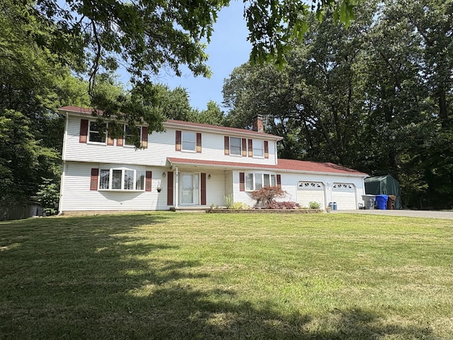 109 Middle Rd, Enfield, CT 06082 - view of front of property featuring asphalt driveway, a chimney, a garage, a front yard, and a porch