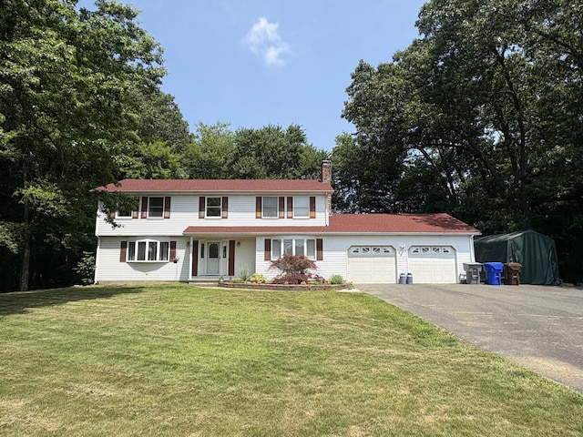 109 Middle Rd, Enfield, CT 06082 - view of front of home featuring a chimney, driveway, a garage, and a front yard
