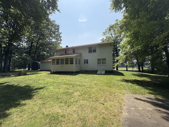 109 Middle Rd, Enfield, CT 06082 - back of property with a chimney and a yard