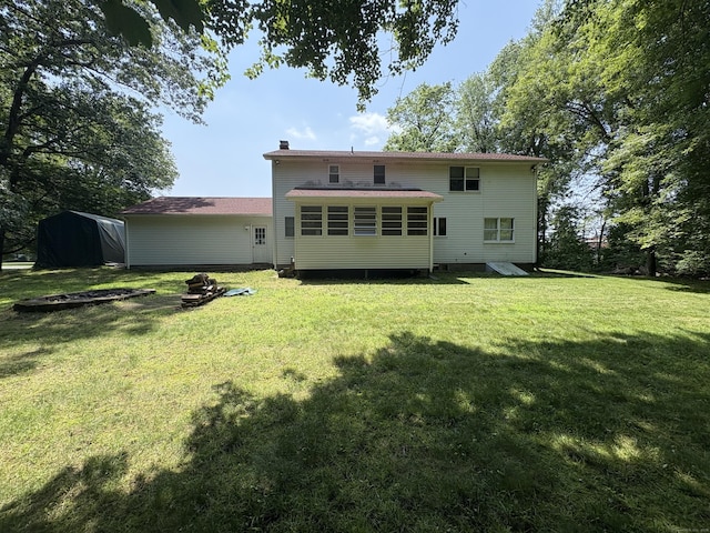 109 Middle Rd, Enfield, CT 06082 - rear view of property featuring a chimney and a lawn