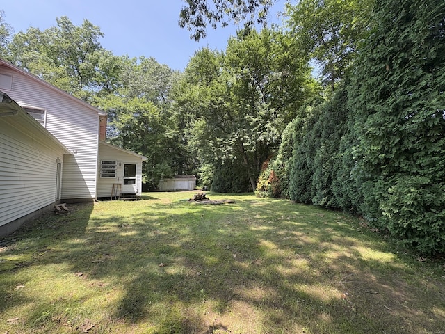 109 Middle Rd, Enfield, CT 06082 - view of grassy yard featuring a storage shed