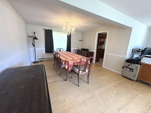 109 Middle Rd, Enfield, CT 06082 - dining area featuring light wood-type flooring, a textured ceiling, a chandelier, and a baseboard heating unit