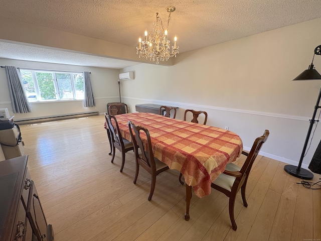 109 Middle Rd, Enfield, CT 06082 - dining area with a baseboard heating unit, a textured ceiling, light wood-style flooring, a chandelier, and a wall mounted air conditioner