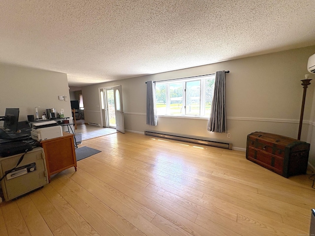 109 Middle Rd, Enfield, CT 06082 - living room with a baseboard heating unit, a textured ceiling, light wood-style floors, and a baseboard radiator
