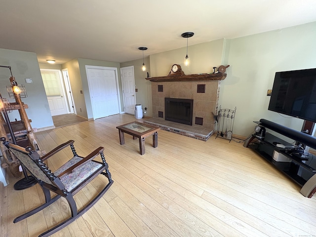 109 Middle Rd, Enfield, CT 06082 - living room featuring hardwood / wood-style flooring and a fireplace with raised hearth
