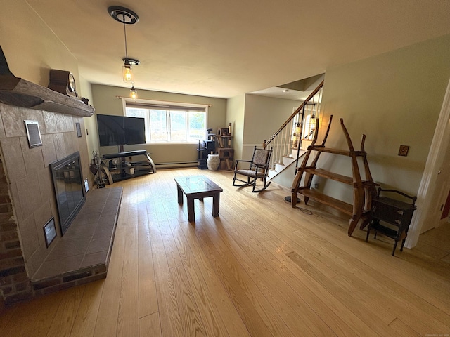 109 Middle Rd, Enfield, CT 06082 - living area featuring a fireplace, wood-type flooring, and stairs