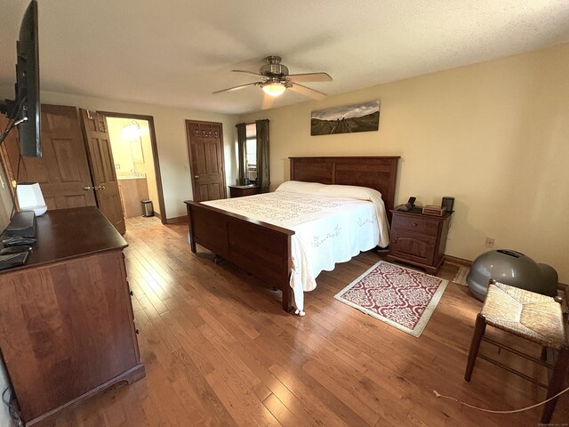 109 Middle Rd, Enfield, CT 06082 - bedroom with wood-type flooring, ensuite bathroom, and a ceiling fan