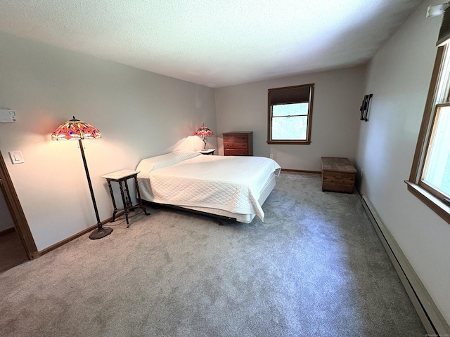 109 Middle Rd, Enfield, CT 06082 - bedroom featuring carpet, baseboard heating, and a textured ceiling