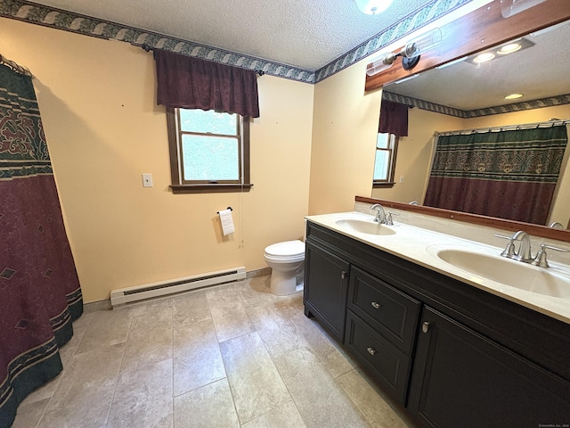 109 Middle Rd, Enfield, CT 06082 - full bathroom with a baseboard radiator, double vanity, and a textured ceiling