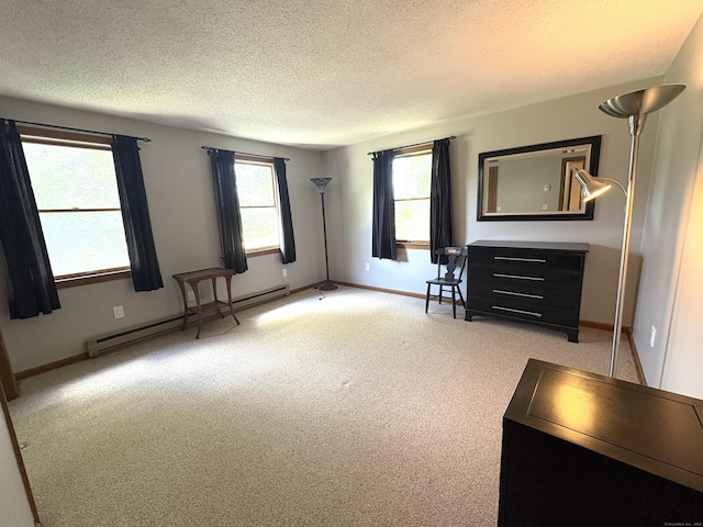 109 Middle Rd, Enfield, CT 06082 - unfurnished bedroom with baseboard heating, a textured ceiling, and light carpet