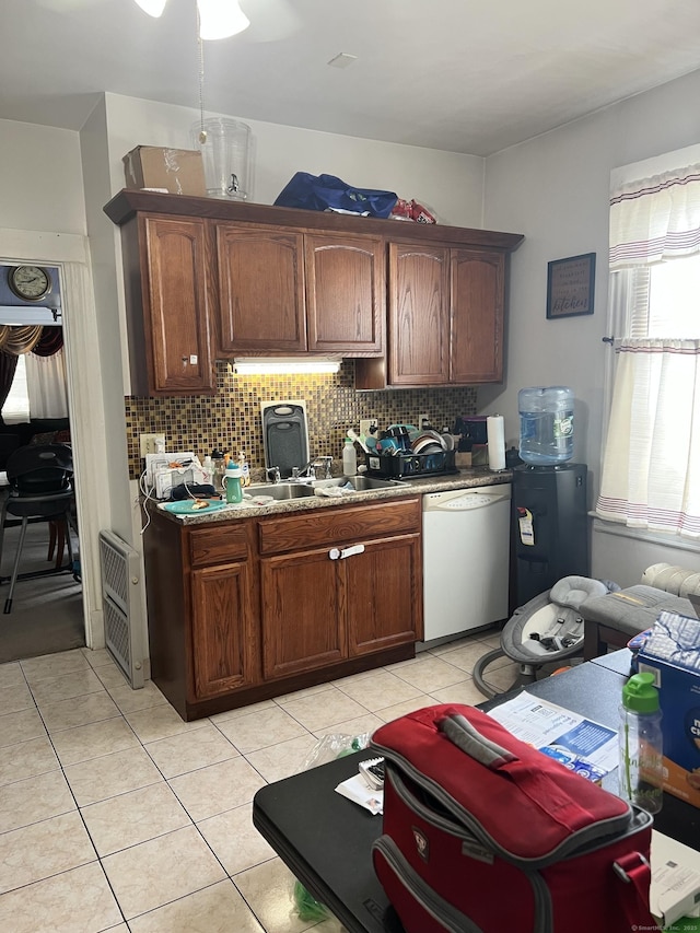 70 Burnham St, Hartford, CT 06112 - kitchen featuring white dishwasher, backsplash, light tile patterned flooring, and heating unit