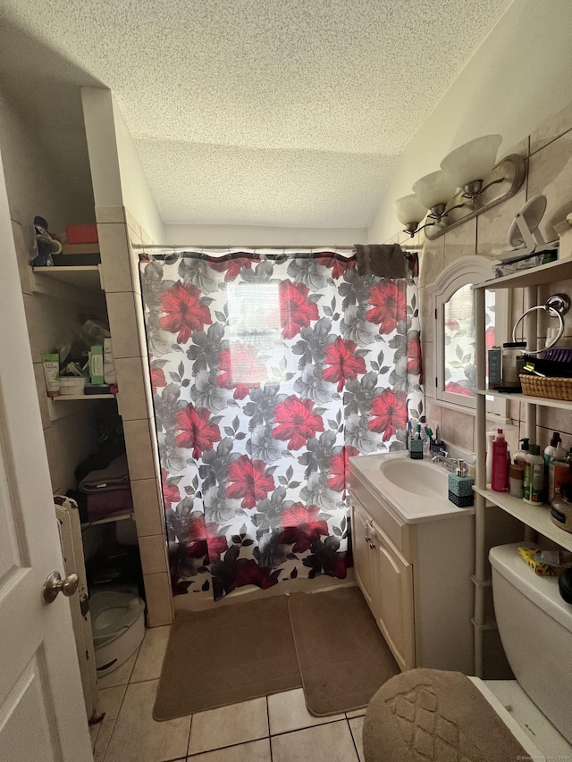 70 Burnham St, Hartford, CT 06112 - bathroom with vanity, a textured ceiling, tile patterned floors, a shower with shower curtain, and lofted ceiling