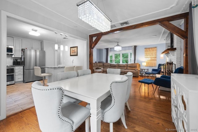1996 Straits Tpke, Middlebury, CT 06762 - dining area featuring a chandelier and light wood-style flooring